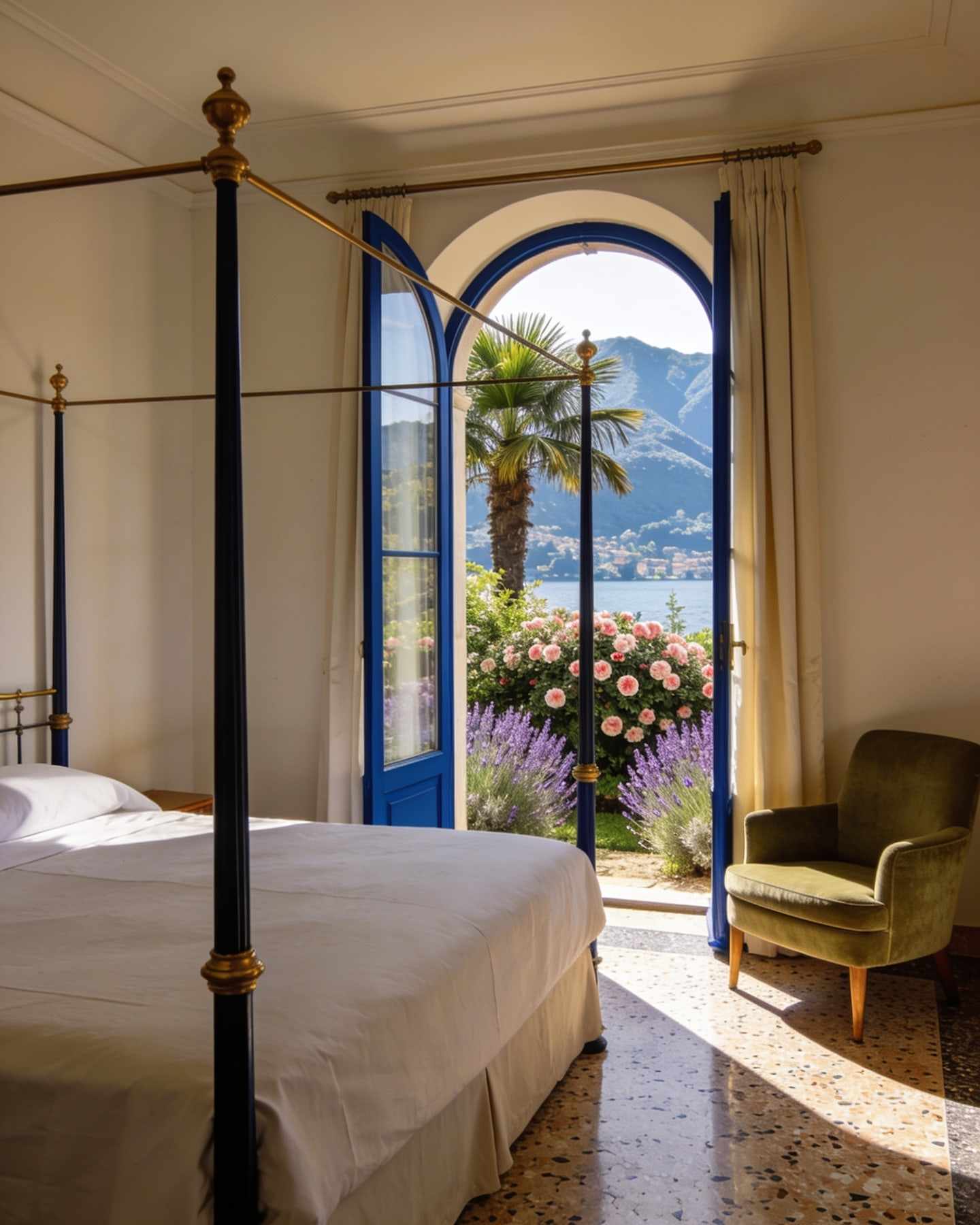 A ground-floor room with an arched window onto a garden of camellias and lavender, a four-poster bed with white linen.